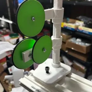 3D printed fishing rod guide wrapping holder mounted on Craftsman base with green thread tension discs.